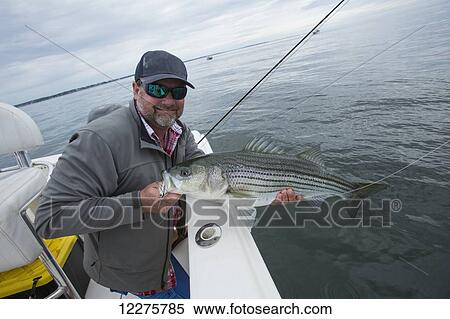 Stock Photography - Fishing in Boston Harbour; Boston, Massachusetts, United States of America. Fotosearch