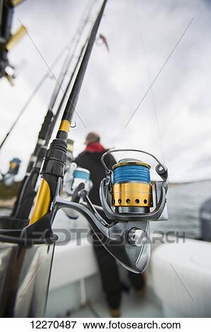 Stock Photo - Fishing rods on a boat off the Atlantic coast; Maine, United States of America. Fotosearch