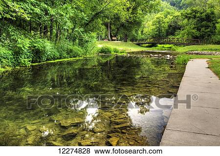 Foot bridge crossing Little Paint Creek at Yellow River State Forest; Iowa, United States of America View Large Photo Image Stock Photo - Foot bridge crossing Little Paint Creek at Yellow River State Forest; Iowa, United States of America. Fotosearch