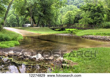 Foot bridge crossing Little Paint Creek at Yellow River State Forest; Iowa, United States of America View Large Photo Image Stock Photo - Foot bridge crossing Little Paint Creek at Yellow River State Forest; Iowa, United States of America. Fotosearch