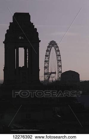Freemason's Hall and the London Eye seen in silhouette above the rooftops of Covent Garden; London, England View Large Photo Image Stock Image - Freemason's Hall and the London Eye seen in silhouette above the rooftops of Covent Garden; London, England. Fotosearch