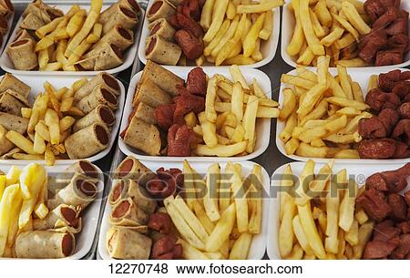 Fried food such as wieners and fries for sale at a stand; Puerto Vallarta, Jalisco, Mexico View Large Photo Image Stock Photo - Fried food such as wieners and fries for sale at a stand; Puerto Vallarta, Jalisco, Mexico. Fotosearch