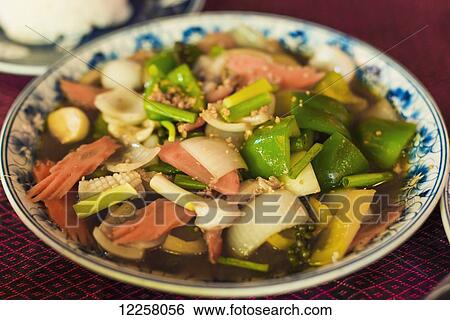 Stock Photograph - Fry seafood and vegetables, Khmer style; Siem Reap, Cambodia. Fotosearch
