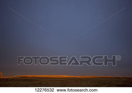 Glow over farmland at sunset; Manitoba, Canada View Large Photo Image Stock Image - Glow over farmland at sunset; Manitoba, Canada. Fotosearch