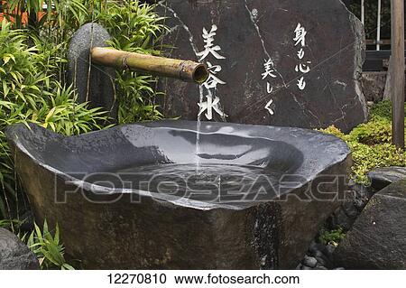 Grey stone water fountain at a Japanese temple; Kyoto, Japan View Large Photo Image Stock Image - Grey stone water fountain at a Japanese temple; Kyoto, Japan. Fotosearch