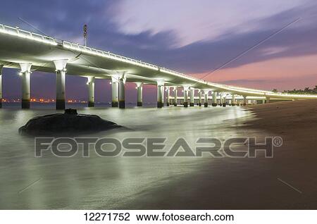 Stock Image - Highway along the beach; Xiamen, Fujian province, China. Fotosearch