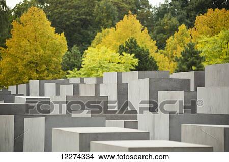 Holocaust Memorial designed by US architect Peter Eisenmann, the gray slabs commemorate the millions of Jews killed by the Nazis; Berlin, Germany View Large Photo Image Picture - Holocaust Memorial designed by US architect Peter Eisenmann, the gray slabs commemorate the millions of Jews killed by the Nazis; Berlin, Germany. Fotosearch