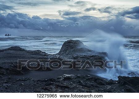 Huge waves crash along the shores of Dyrholaey, along the southern shores of Iceland; Iceland View Large Photo Image Stock Photography - Huge waves crash along the shores of Dyrholaey, along the southern shores of Iceland; Iceland. Fotosearch