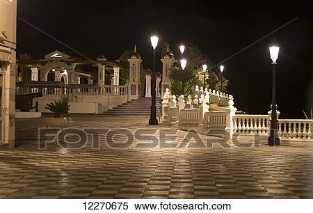 Lampposts illuminated along the promenade at nighttime; Benidorm, Spain View Large Photo Image Stock Photography - Lampposts illuminated along the promenade at nighttime; Benidorm, Spain. Fotosearch