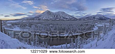 Late winter afternoon light warms up the mountains along the Takhini River, near Whitehorse; Yukon, Canada View Large Photo Image Stock Photo - Late winter afternoon light warms up the mountains along the Takhini River, near Whitehorse; Yukon, Canada. Fotosearch