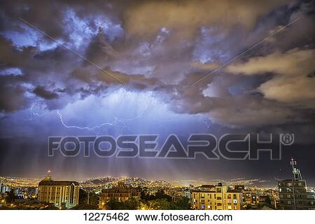 Stock Image - Lightning lights up the night skies above the city of Cochabamba; Cochabamba, Bolivia. Fotosearch
