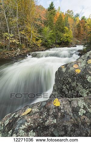 Long exposure of water flowing down Kama falls in the autumn, near Dorset; Ontario, Canada View Large Photo Image Stock Photograph - Long exposure of water flowing down Kama falls in the autumn, near Dorset; Ontario, Canada. Fotosearch