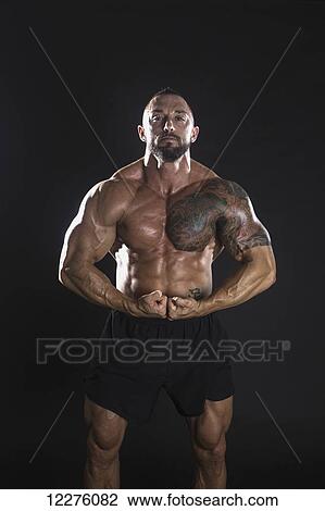 Stock Image - Male body builder; Kailua, Hawaii, United States of America. Fotosearch