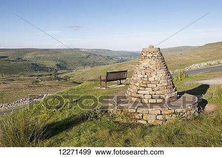 Stock Photo - Millenium Cairn on the Buttertubs pass, Swaledale, marking the boundary of Muker Parish; Yorkshire, England. Fotosearch