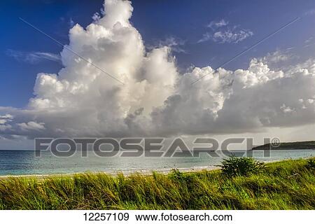 Stock Photo - Morning clouds over Dickenson Bay; Antigua, West Indies. Fotosearch