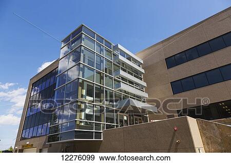 Stock Photo - New construction of office building with glass stairway feature; Edmonton, Alberta, Canada. Fotosearch