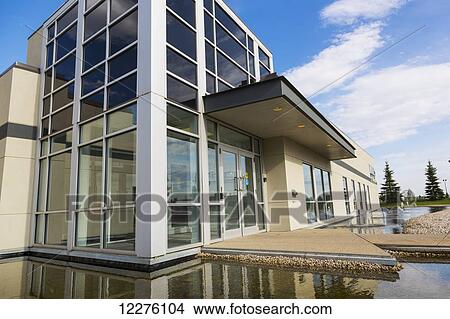 Picture - New construction of warehouse building with water feature; Edmonton, Alberta, Canada. Fotosearch