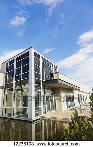 Stock Image - New construction of warehouse building with water feature; Edmonton, Alberta, Canada. Fotosearch