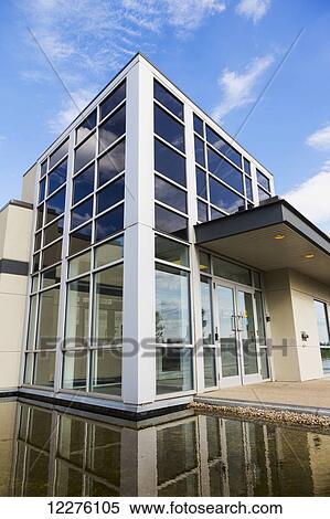 Stock Photography - New construction of warehouse building with water feature; Edmonton, Alberta, Canada. Fotosearch