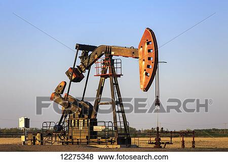 Oil well pump jack in the Bakken Oil Field, near Estevan; Saskatchewan, Canada View Large Photo Image Stock Photo - Oil well pump jack in the Bakken Oil Field, near Estevan; Saskatchewan, Canada. Fotosearch