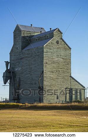 Old grain elevator against a blue sky; Camrose, Alberta, Canada View Large Photo Image Stock Image - Old grain elevator against a blue sky; Camrose, Alberta, Canada. Fotosearch