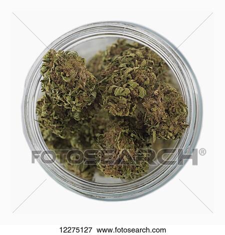 Stock Photo - Overhead view of jar filled with marijuana; Boston, Massachusetts, United States of America . Fotosearch