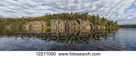 Panoramic view of the cliffs in Rock Lake in autumn, Algonquin Park; Ontario, Canada View Large Photo Image Stock Image - Panoramic view of the cliffs in Rock Lake in autumn, Algonquin Park; Ontario, Canada. Fotosearch