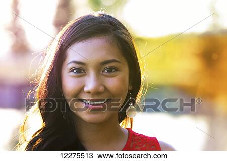 Portrait of a beautiful young Filipino woman smiling; St. Albert, Alberta, Canada View Large Photo Image Stock Image - Portrait of a beautiful young Filipino woman smiling; St. Albert, Alberta, Canada. Fotosearch