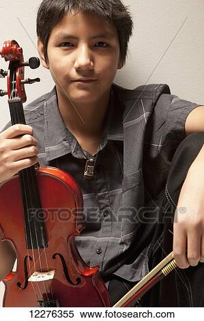 Portrait of a boy with a violin; Edmonton, Alberta, Canada View Large Photo Image Stock Photography - Portrait of a boy with a violin; Edmonton, Alberta, Canada. Fotosearch