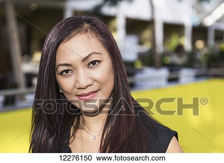 Portrait of a businesswoman in a shopping complex; St. Albert, Alberta, Canada View Large Photo Image Stock Image - Portrait of a businesswoman in a shopping complex; St. Albert, Alberta, Canada. Fotosearch