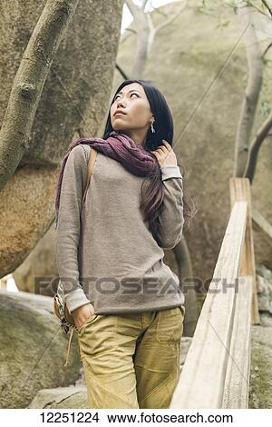 Picture - Portrait of a female model on a trail; Xiamen, China. Fotosearch