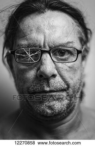 Portrait of a man with cracked glass on one side of his eyeglasses; Tarifa, Cadiz, Andalusia, Spain View Large Photo Image Stock Photo - Portrait of a man with cracked glass on one side of his eyeglasses; Tarifa, Cadiz, Andalusia, Spain. Fotosearch
