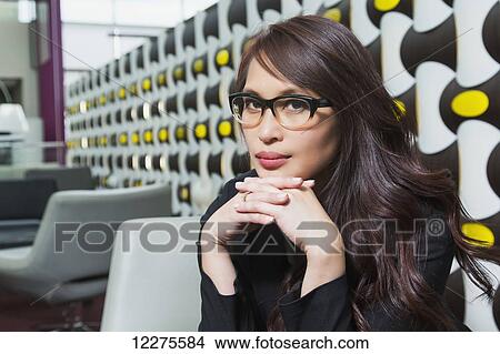 Picture - Portrait of a professional businesswoman in a lounge area of a shopping centre; St. Albert, Alberta, Canada. Fotosearch