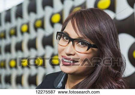 Portrait of a professional businesswoman in a lounge area of a shopping centre; St. Albert, Alberta, Canada View Large Photo Image Stock Photo - Portrait of a professional businesswoman in a lounge area of a shopping centre; St. Albert, Alberta, Canada. Fotosearch