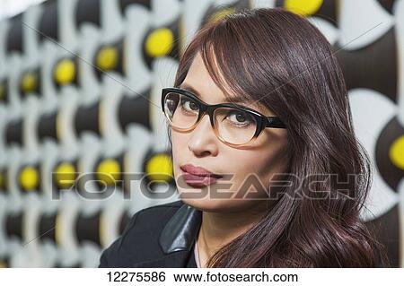 Portrait of a professional businesswoman in a lounge area of a shopping centre; St. Albert, Alberta, Canada View Large Photo Image Stock Photograph - Portrait of a professional businesswoman in a lounge area of a shopping centre; St. Albert, Alberta, Canada. Fotosearch