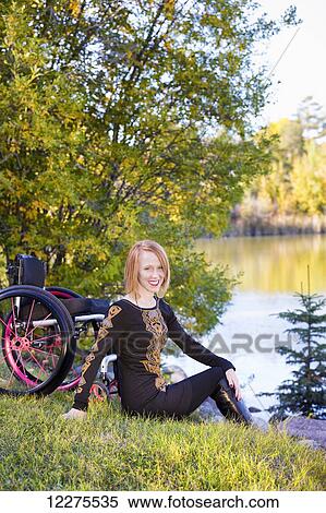 Stock Photography - Portrait of a young disabled woman in a city park in autumn; Edmonton, Alberta, Canada. Fotosearch