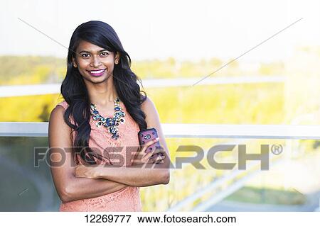 Portrait of a young professional businesswoman in downtown setting; Edmonton, Alberta, Canada View Large Photo Image Stock Photo - Portrait of a young professional businesswoman in downtown setting; Edmonton, Alberta, Canada. Fotosearch
