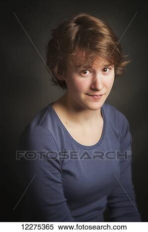 Stock Photography - Portrait of a young woman looking at the camera with a troubled, worried look on her face; United States of America. Fotosearch