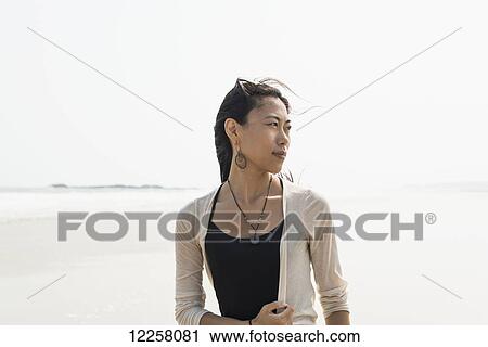 Portrait of a young woman looking back; HuoHu, Taiwan View Large Photo Image Stock Image - Portrait of a young woman looking back; HuoHu, Taiwan. Fotosearch