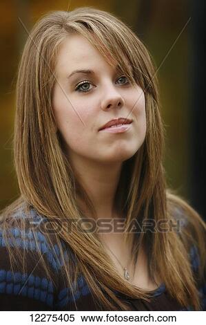 Portrait of a young woman with long blond hair; United States of America View Large Photo Image Stock Photography - Portrait of a young woman with long blond hair; United States of America. Fotosearch
