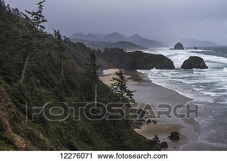 Rain creates a somber mood on the Oregon Coast; Cannon Beach, Oregon, United States of America View Large Photo Image Stock Image - Rain creates a somber mood on the Oregon Coast; Cannon Beach, Oregon, United States of America. Fotosearch