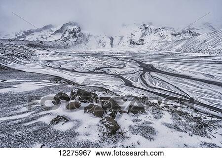 Stock Photo - Remains of the glacial lake and the mountain that used to be at the base of the volcano Eyjafjallajokull which eruoted in 2010; Thorsmork, Iceland. Fotosearch