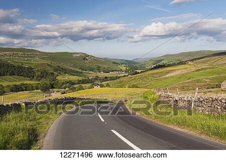 Stock Photograph - Road into Thwaite from the Buttertubs, Swaledale; North Yorkshire, England. Fotosearch