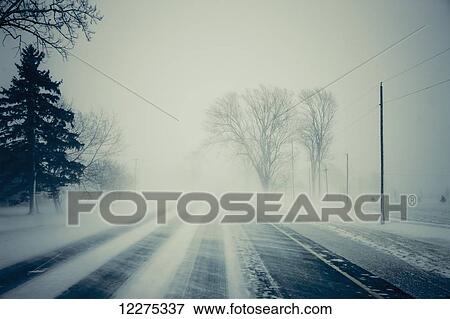 Road with blowing snow; Ontario, Canada View Large Photo Image Stock Photo - Road with blowing snow; Ontario, Canada. Fotosearch