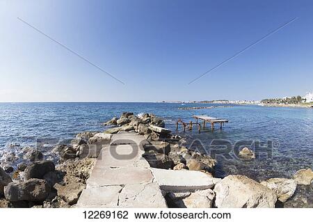 Rock path leading out to the Mediterranean sea; Paphos, Cyprus View Large Photo Image Stock Image - Rock path leading out to the Mediterranean sea; Paphos, Cyprus. Fotosearch