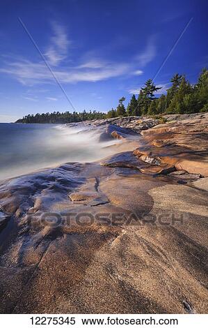 Stock Photography - Rocky shoreline of Lake Superior at Katherine Cove, Lake Superior Provincial Park; Ontario, Canada. Fotosearch