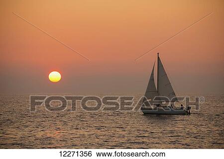 Sailboat sailing at sunset; Wailea, Maui, Hawaii, United States of America View Large Photo Image Stock Photograph - Sailboat sailing at sunset; Wailea, Maui, Hawaii, United States of America. Fotosearch