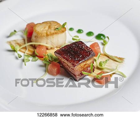 Stock Photo - Scallop and pork belly appetizer with melon; Ontario, Canada. Fotosearch