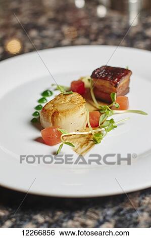 Scallop and pork belly appetizer with melon; Ontario, Canada View Large Photo Image Stock Photograph - Scallop and pork belly appetizer with melon; Ontario, Canada. Fotosearch