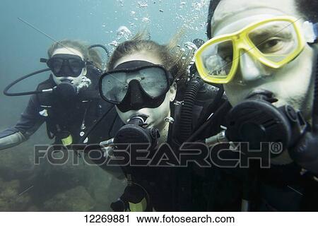 Scuba divers posing underwater; Ixtapa-Zihuatanejo, Guerrero, Mexico View Large Photo Image Stock Image - Scuba divers posing underwater; Ixtapa-Zihuatanejo, Guerrero, Mexico. Fotosearch